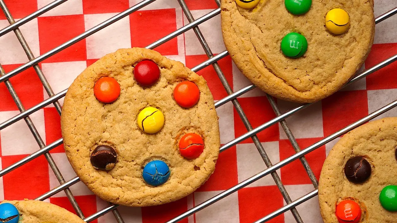 Fresh chocolate chip cookies cooling on a wire rack